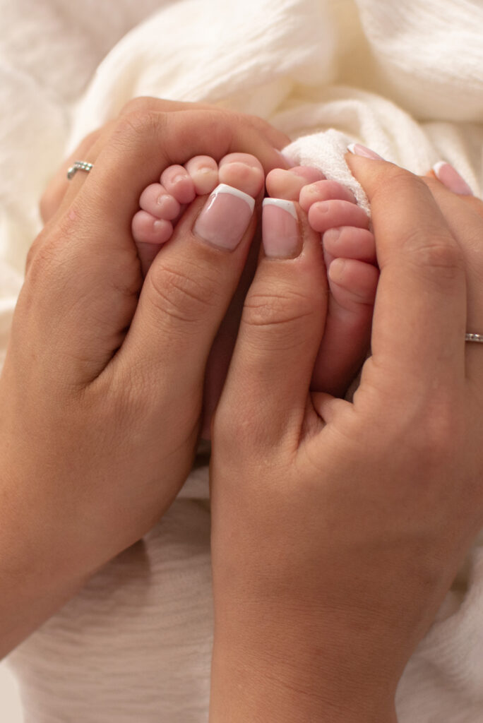 West Sussex Photographer - Elizabeth Cole Photography - newborn toes wrapped around mums hand